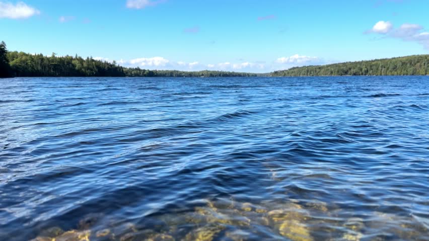 Long Pond in Acadia National Park Maine with blue lake water and forest