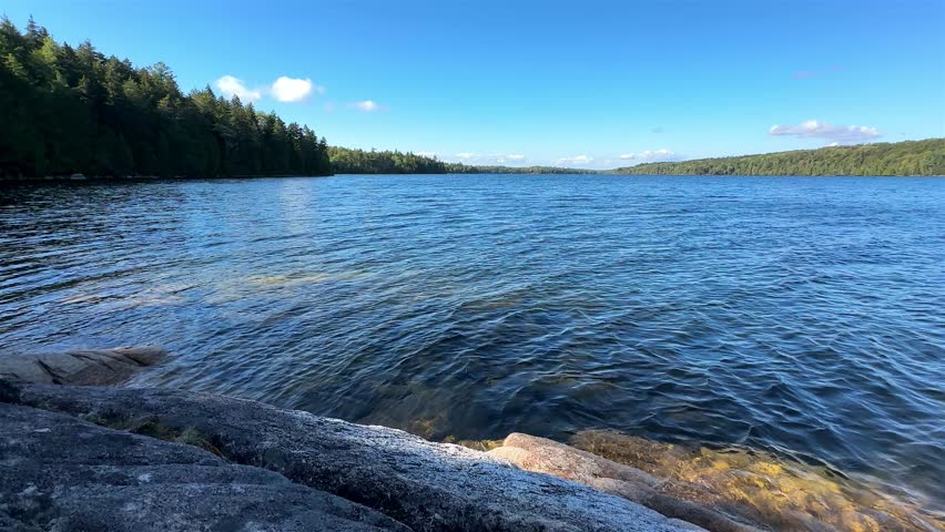 Beautiful Long Pond in Acadia National Park with rocky shoreline view