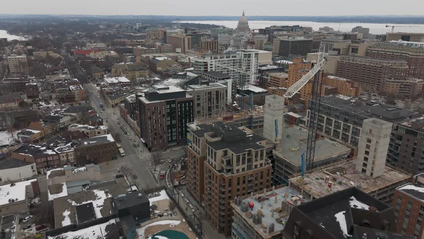 Vertical aerial of textured ice patterns across Lake Mendota in Madison creating abstract natural background visuals.