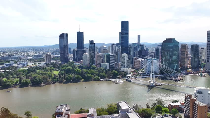 Brisbane city downtown on riverside with bridge, skyline. Australian big city drone cityscape.