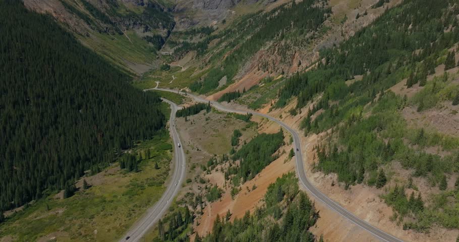High elevation roadway crossing open mountain slopes in the Colorado San Juans, Million Dollay Highway Colorado USA