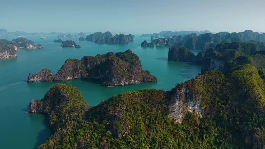 Stunning aerial view of Halong bay with cruise boats and limestone islets, tourist landmark of Vietnam