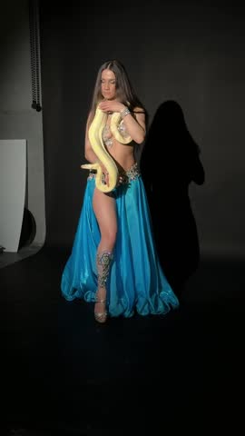 Exotic Belly Dancer Posing with Albino Python in Studio