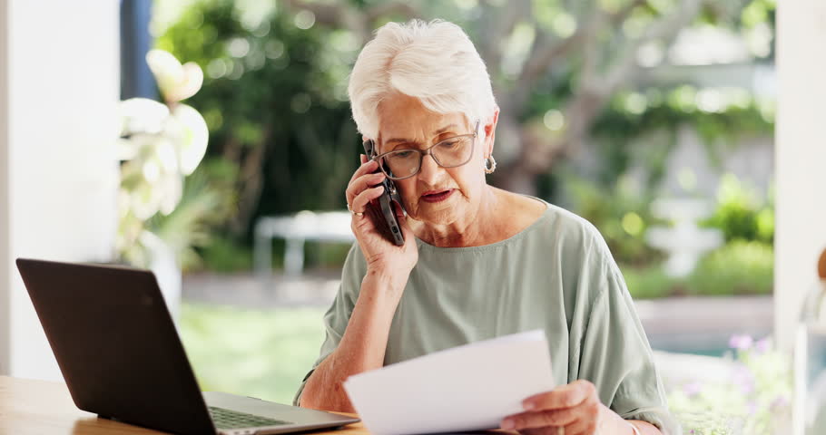 Phone call, document and old woman in home for finance, pension or insurance application with laptop. Tech, talk and elderly person with paperwork for retirement annuity, 401k and smile at patio
