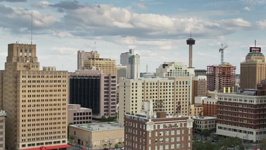 San Antonio skyline featuring downtown buildings and the iconic Tower of the Americas.
