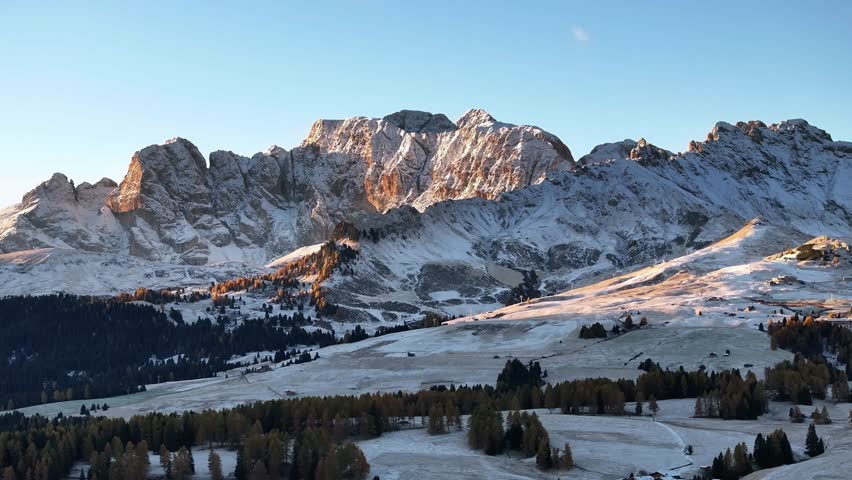 Alpe di Siusi, Seiser Alm, aerial view of majestic dolomites alpine peaks covered in light snow