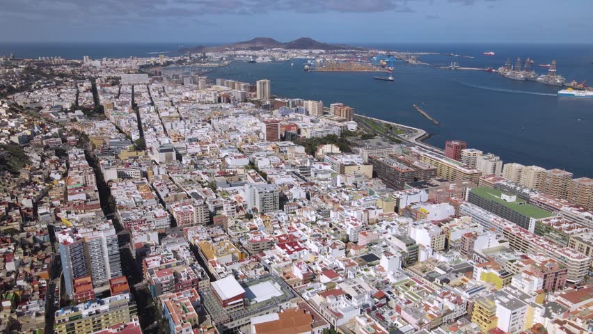 Vast urban landscape of Las Palmas featuring the colorful districts and harbor