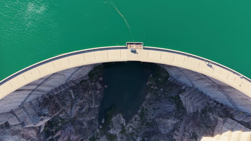 Zenithal drone view of Agua del Toro dam: A perfect symmetrical double-curvature arch dam in Mendoza, Argentina.