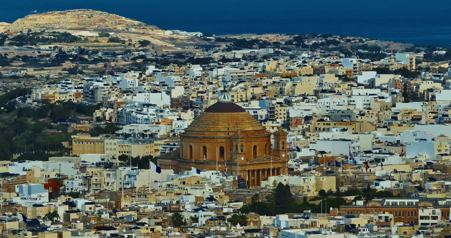 Aerial view of Mosta Church, famous remarkable wartime miracle, architectural landmarks, Malta 