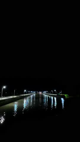 Canal at Night with Lights Reflection