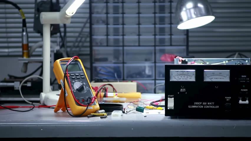 Laboratory setup featuring electronic equipment with precise measurements in high definition, showcasing a bright workspace