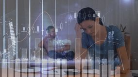 Animation of graphs, numbers, buildings over stressed caucasian woman examining bills at home. Digital composite, multiple exposure, report, home finance, expenses, skyscraper and debt concept. - Powered by Shutterstock - Get 15% off with code: PIKWIZARD15