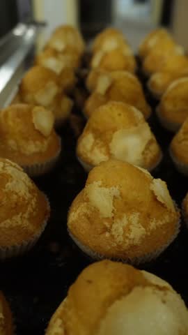 Freshly baked muffins cooling on a tray