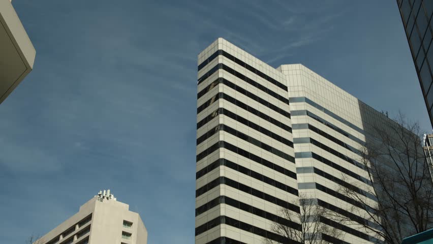 View of modern buildings and clear sky in downtown area during the afternoon