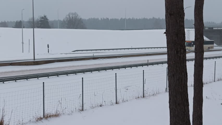Public transportation navigation during winter. Regional mobility showcased on snowcovered highway with bus
