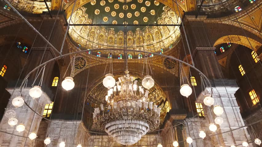 The interior of the Hagia Sophia in Istanbul, Turkey, showcases stunning Byzantine architecture with a massive dome, religious paintings and ornate decorations from its history as a cathedral and mosque