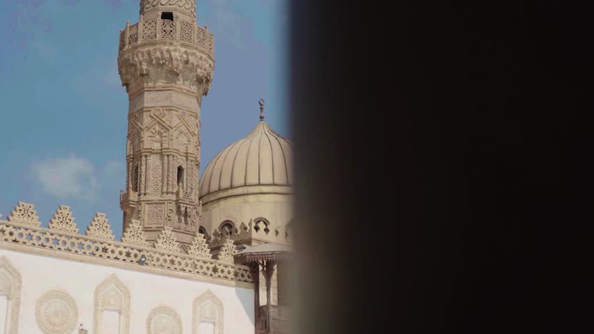 The Great Al Azhar Mosque of Cairo is a historic landmark of Arabic architecture featuring a towering minaret and elegant dome against the Egyptian sky for travelers seeking religious culture