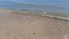 Summer seashore: Crystal-clear water washes small pebbles onto the bright beach. - Powered by Shutterstock - Get 15% off with code: PIKWIZARD15