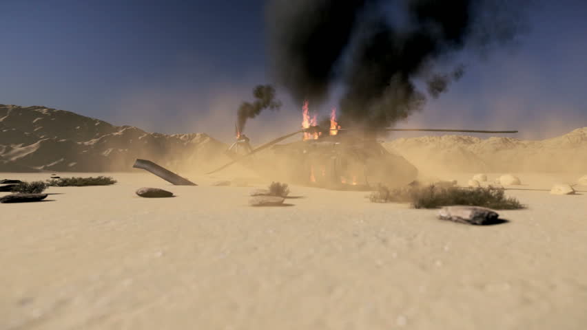 Army chopper on fire after being shot in battle in the desert
