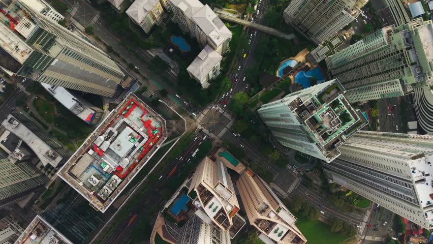 Sunset drone view, Bonifacio Global City streets, lights, modern skyline