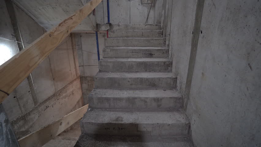 Concrete stairs under construction, unfinished building.