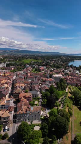 Nyon Switzerland town Lake Geneva shore, aerial drone vertical video Europe