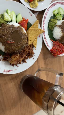 Authentic Indonesian Spicy Rice Plate with Fried Chicken Sambal and Tofu