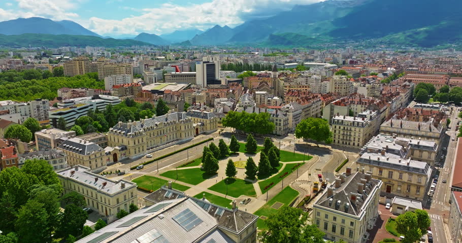 Aerial view of Grenoble. Panoramic view featuring the Isere river, urban landscape, mountains in the French Alps at summer