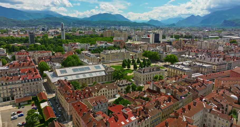 Aerial view of Grenoble. Panoramic view featuring the Isere river, urban landscape, mountains in the French Alps at summer