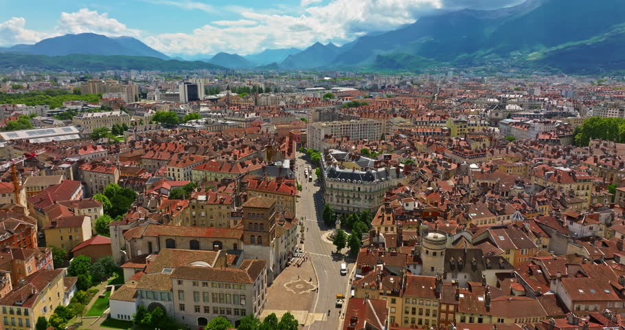 Aerial view of Grenoble. Panoramic view featuring the Isere river, urban landscape, mountains in the French Alps at summer