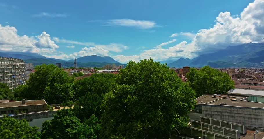Aerial view of Grenoble. Panoramic view featuring the Isere river, urban landscape, mountains in the French Alps at summer