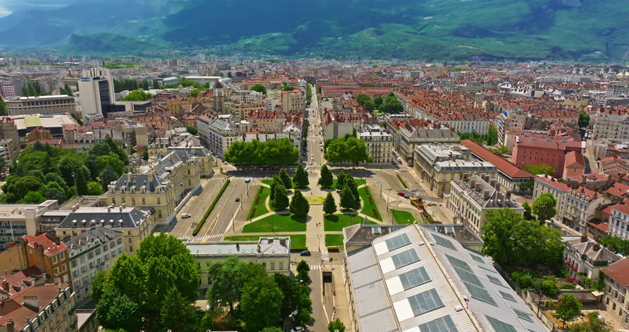 Aerial view of Grenoble. Panoramic view featuring the Isere river, urban landscape, mountains in the French Alps at summer