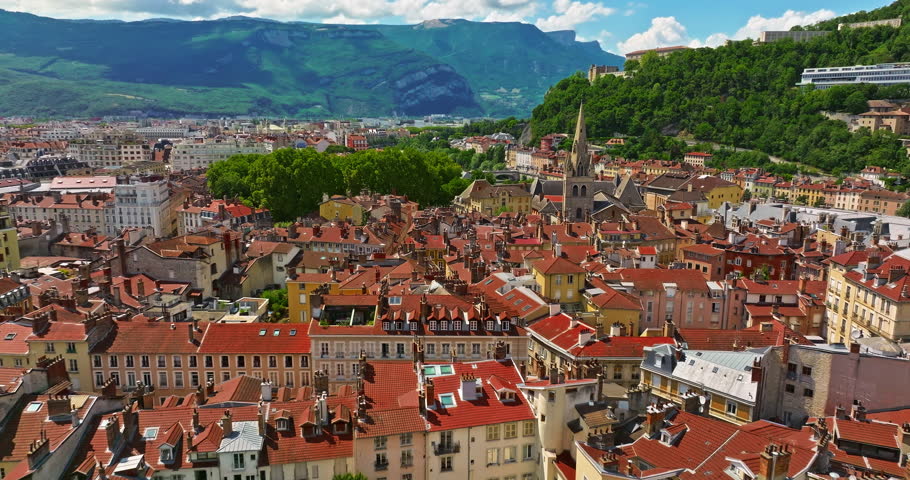Aerial view of Grenoble. Panoramic view featuring the Isere river, urban landscape, mountains in the French Alps at summer