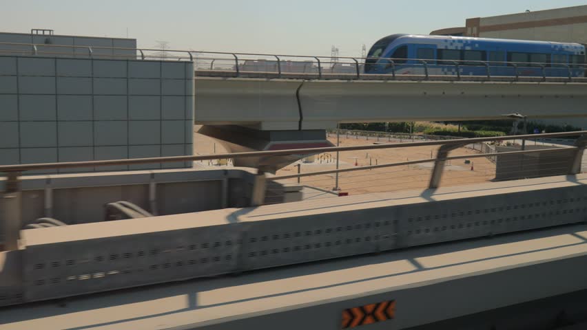 City views, Metro and rails. Skyscrapers and roads, streets and buildings. On the streets of Dubai, in a public place.