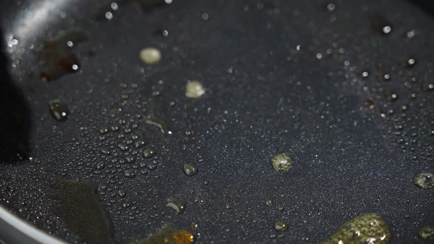 Frying white fish fillets. Frying hake fillets in a hot pan Mastering art of frying golden cod with precise tools. Expertly preparing and frying fish using appropriate utensils. Selective focus