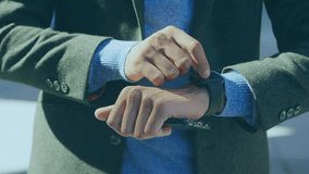 Animation of icons and network of connections over caucasian businessman using smartwatch. social media, connections, communication and technology concept digitally generated video. - Powered by Shutterstock - Get 15% off with code: PIKWIZARD15