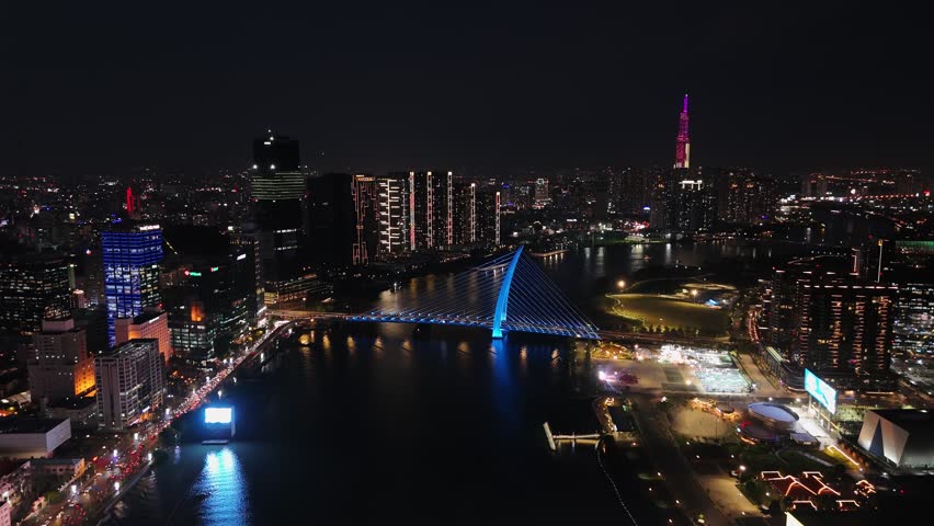 Ho chi minh city aerial night view showing landmark skyscraper on the saigon river in vietnam.