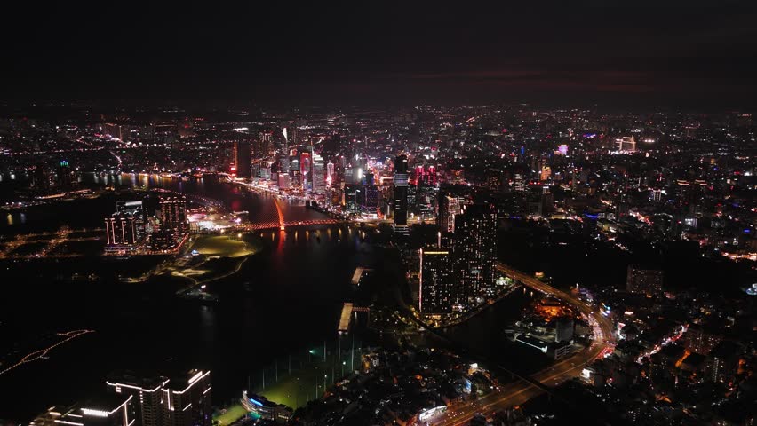 Aerial view of Ho chi minh city skyline at night over the saigon river, vietnam.