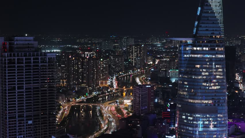 Aerial view of ho chi minh city skyline with busy traffic at night, vietnam.