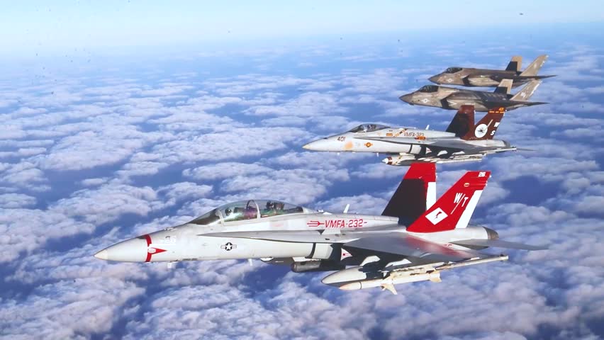 US Marine Corps Fighter Jets Fly in Tight Formation Above Expansive Cloudscape During Mission.