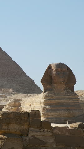 Great Sphinx of Giza and Pyramid of Khafre at background. Giza plateau, Greater Cairo, Egypt. Static real-time footage