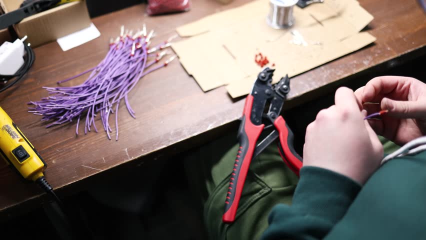 Military ammunition being manufactured. The proces of machining the weapons. Ukrainian production of electrical wires for the defense industry..