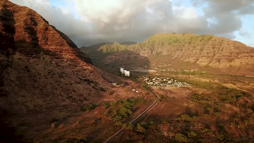 Hawaiian Mountains at sunset in Makaha Valley in NorthWest Oahu, drone footage, Hawaii. High quality 4k footage