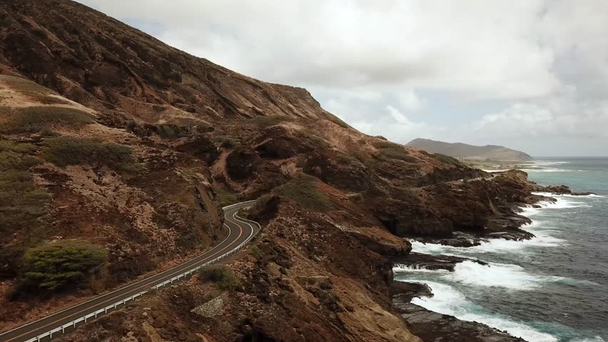 Scenic coastline road with the volcano and the beaches around east side of Honolulu. Turquoise crystal clean ocean and beautiful mountains. Drone footage, Oahu Hawaii. High quality 4k footage