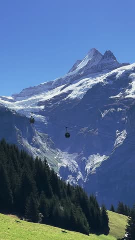 Snow-Covered Peaks and Cable Car Panorama
Distant alpine mountain view with visible cable car line.