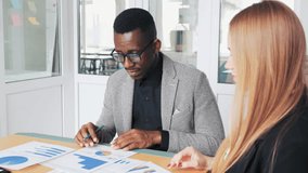 Diverse business partners analyzing financial data in the office - Powered by Shutterstock - Get 15% off with code: PIKWIZARD15