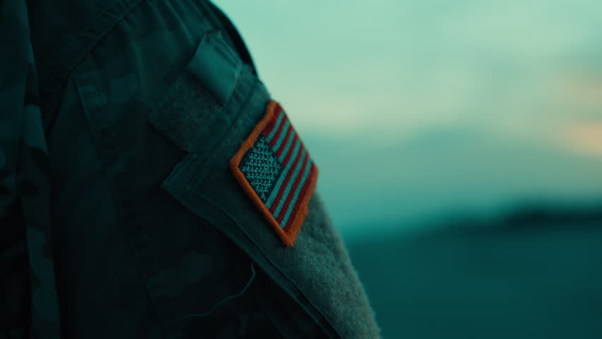American Flag Memorial Day on a Soldiers Arm on the Beach After Sunset