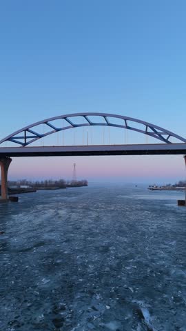 Aerial of Green Bay Wisconsin in Winter at Dusk.  Dynamic Tilting Shot of Leo Frigo by drone.