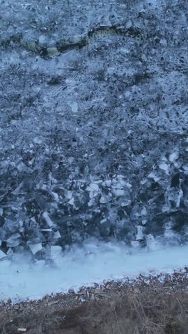 Aerial of the frozen Fox River and Green Bay Wisconsin at Dusk.  Bird