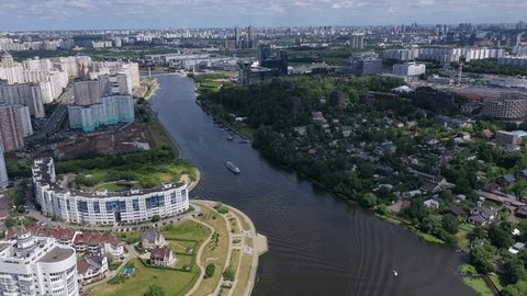 Drone Descending over River Skyline